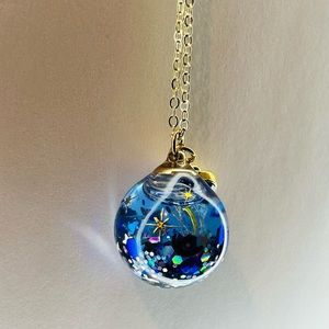 Personalized glass pendants that move inside.